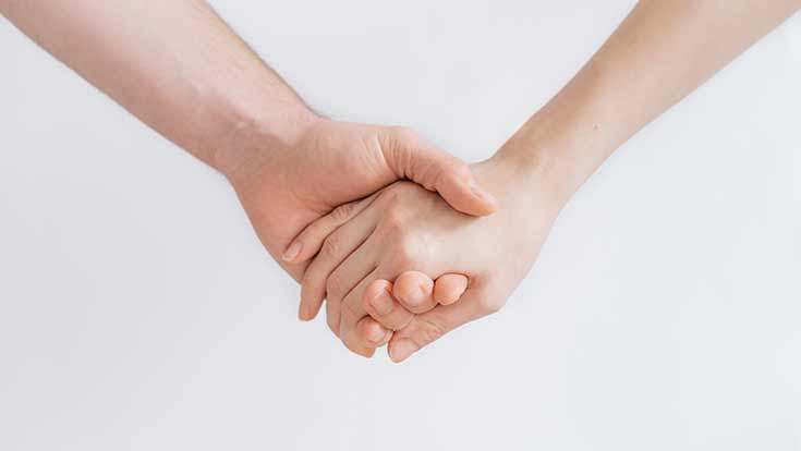 Two people holding Hands